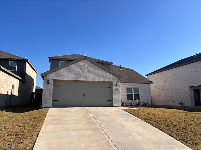 view of front facade featuring concrete driveway, a front yard, brick siding, and a garage