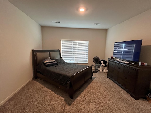 bedroom featuring carpet flooring, baseboards, and visible vents