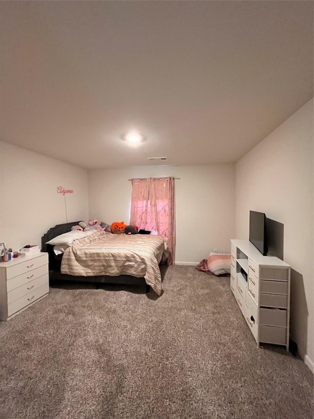 carpeted bedroom with baseboards