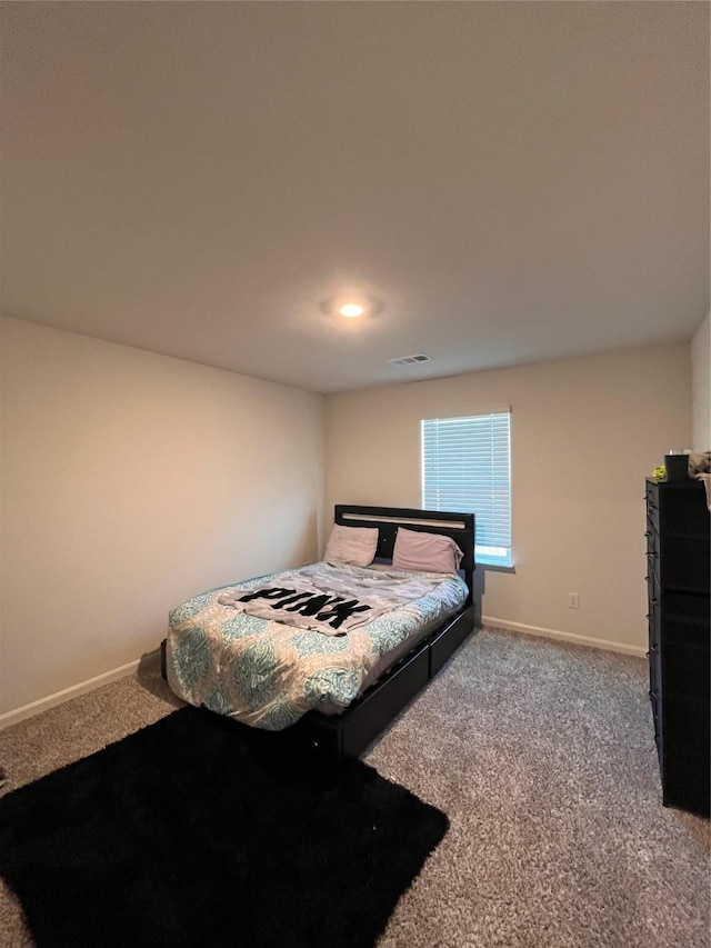 carpeted bedroom featuring visible vents, baseboards, and recessed lighting