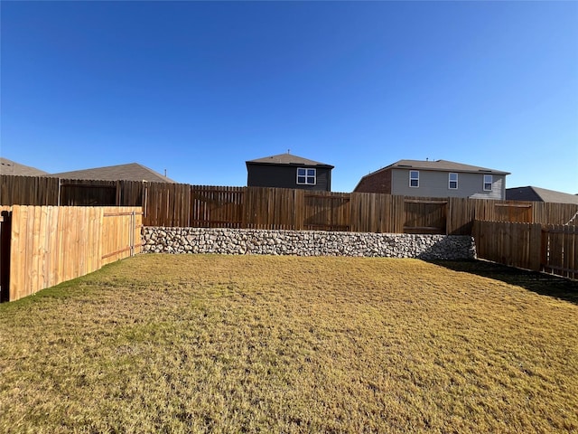 view of yard featuring a fenced backyard