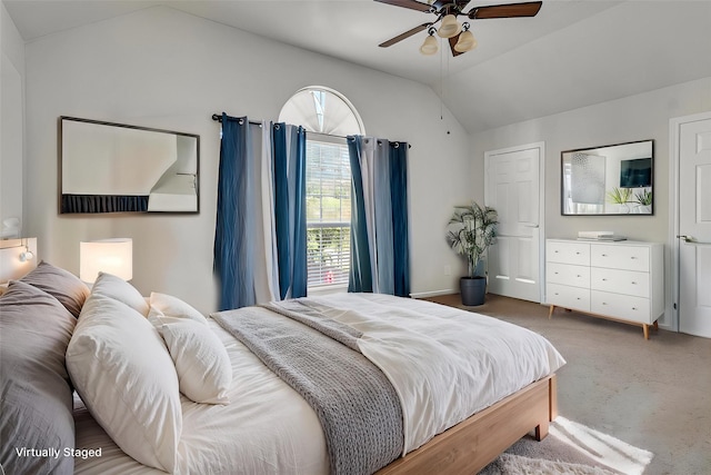 carpeted bedroom with lofted ceiling and ceiling fan