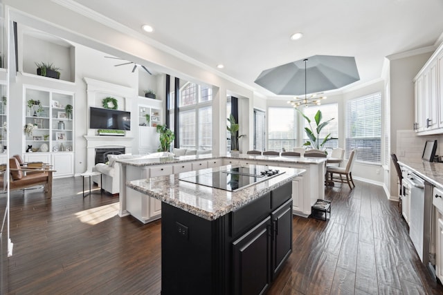 1500 Shropshire St, Keller, TX 76248 - kitchen featuring a center island, black electric stovetop, dark cabinetry, a tray ceiling, and recessed lighting