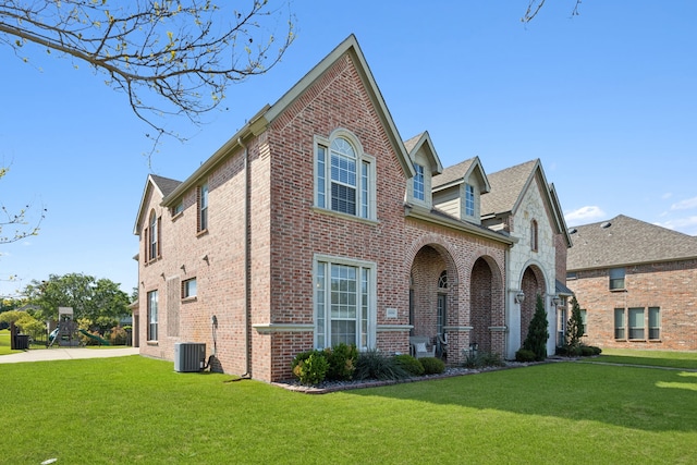 1500 Shropshire St, Keller, TX 76248 - view of front of house with brick siding, a front yard, and cooling unit