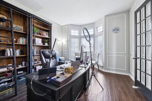 office area with baseboards and dark wood-style flooring