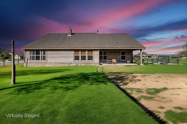 141 York Bridge Rd, Springtown, TX 76082 - rear view of house with a patio area, a yard, and a chimney