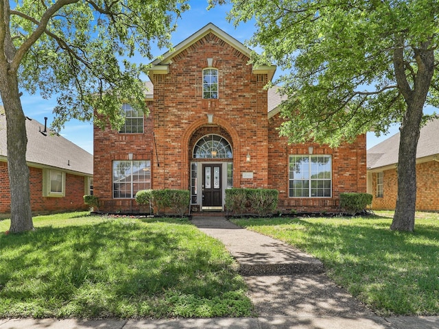 2009 Elmsted Dr, Allen, TX 75013 - traditional-style home featuring brick siding and a front lawn