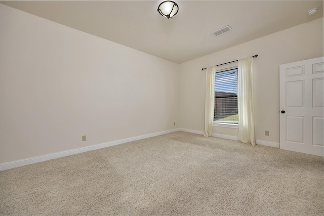 2312 Royce Dr, Arlington, TX 76016 - unfurnished room featuring light carpet, baseboards, and visible vents