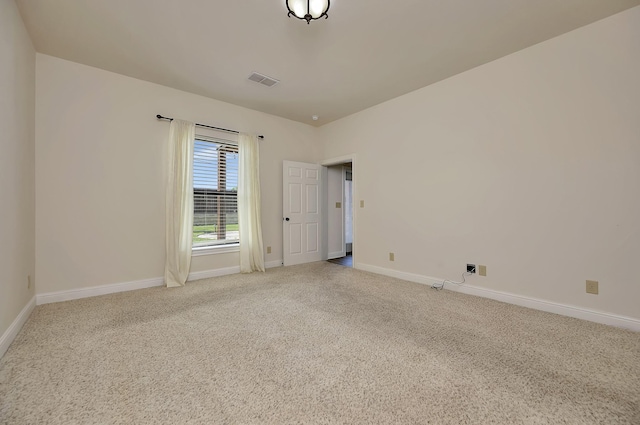 2312 Royce Dr, Arlington, TX 76016 - spare room with visible vents, baseboards, and light colored carpet
