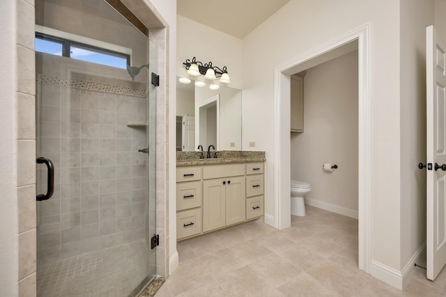 2312 Royce Dr, Arlington, TX 76016 - bathroom with baseboards, toilet, a shower stall, vanity, and tile patterned flooring