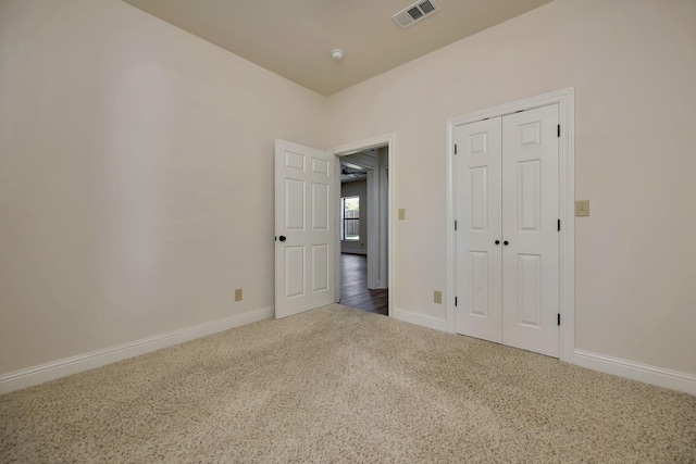 2312 Royce Dr, Arlington, TX 76016 - unfurnished bedroom featuring visible vents, baseboards, a closet, and carpet