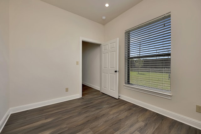 2312 Royce Dr, Arlington, TX 76016 - spare room with dark wood-style flooring, baseboards, and recessed lighting