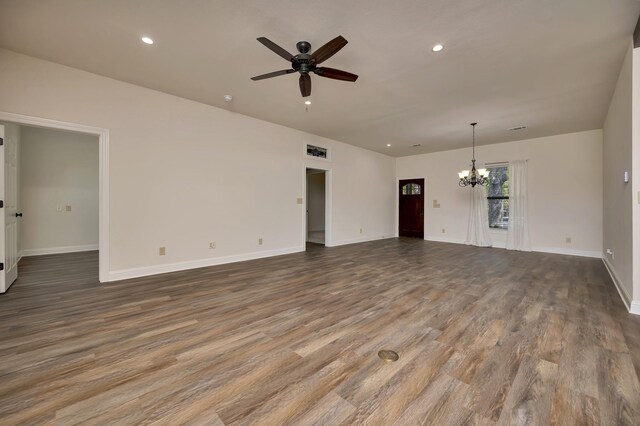 2312 Royce Dr, Arlington, TX 76016 - unfurnished living room featuring recessed lighting, wood finished floors, and ceiling fan with notable chandelier
