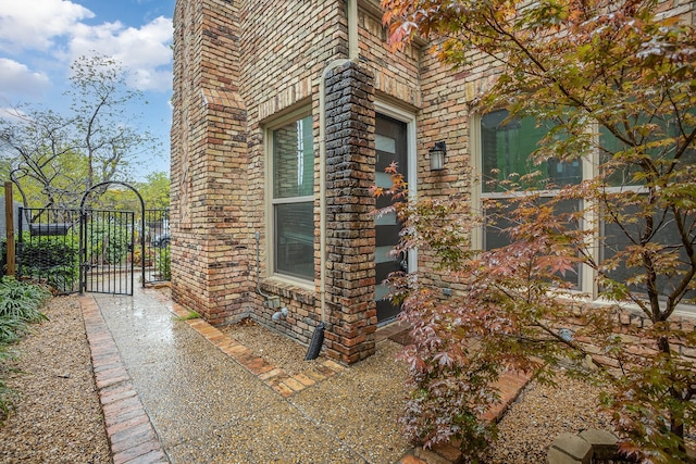 3422 Lovers Ln Unit A, University Park, TX 75225 - view of home's exterior featuring a gate