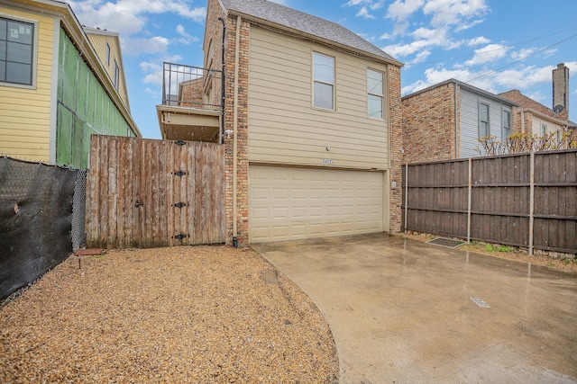 3422 Lovers Ln Unit A, University Park, TX 75225 - view of property exterior featuring a balcony, driveway, and an attached garage