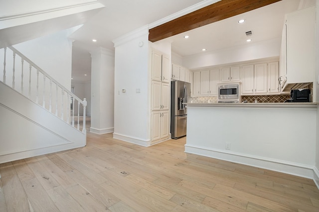 3422 Lovers Ln Unit A, University Park, TX 75225 - kitchen with appliances with stainless steel finishes, tasteful backsplash, light wood finished floors, recessed lighting, and a peninsula