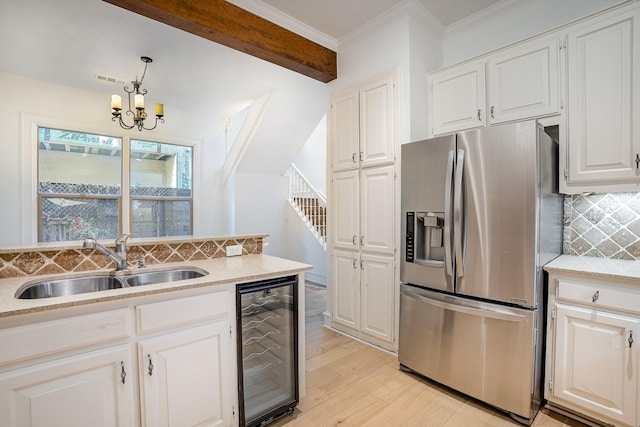 3422 Lovers Ln Unit A, University Park, TX 75225 - kitchen featuring stainless steel fridge with ice dispenser, beverage cooler, a sink, backsplash, and light wood-style floors