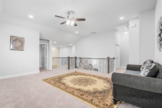living area with light carpet, a ceiling fan, visible vents, and recessed lighting
