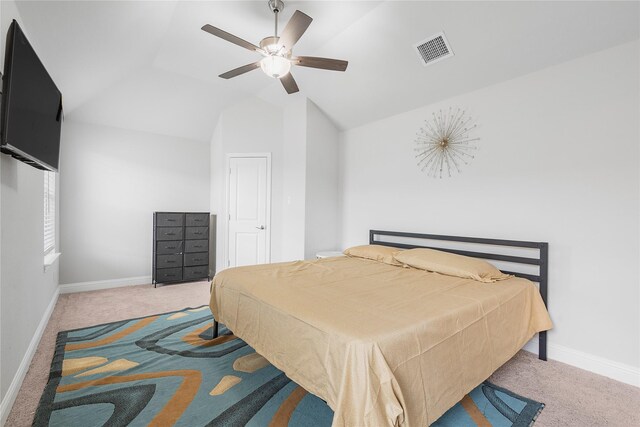 bedroom featuring baseboards, lofted ceiling, carpet, and visible vents