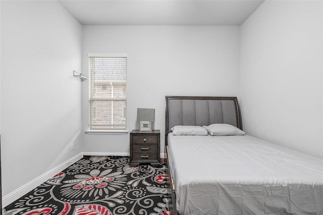 bedroom featuring baseboards