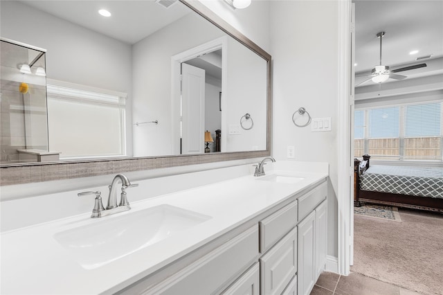 full bath featuring a sink, ceiling fan, double vanity, recessed lighting, and ensuite bath