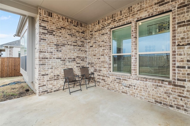 view of patio / terrace featuring fence