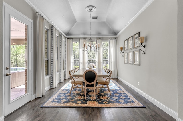 dining area with dark wood finished floors, a notable chandelier, vaulted ceiling, and visible vents