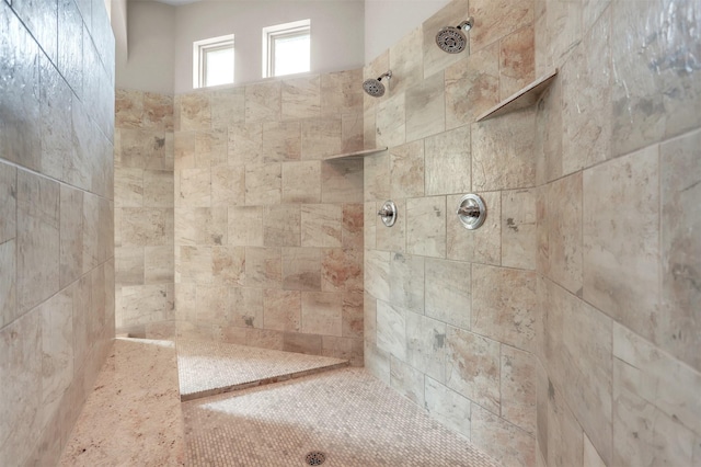 bathroom with tiled shower