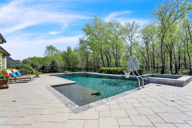 view of swimming pool featuring a pool with connected hot tub and a patio