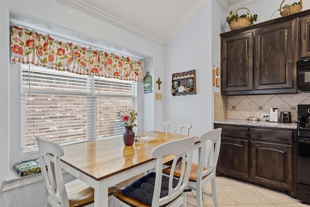 5929 Black Bass Dr, Fort Worth, TX 76179 - dining room with light tile patterned floors, ornamental molding, and vaulted ceiling