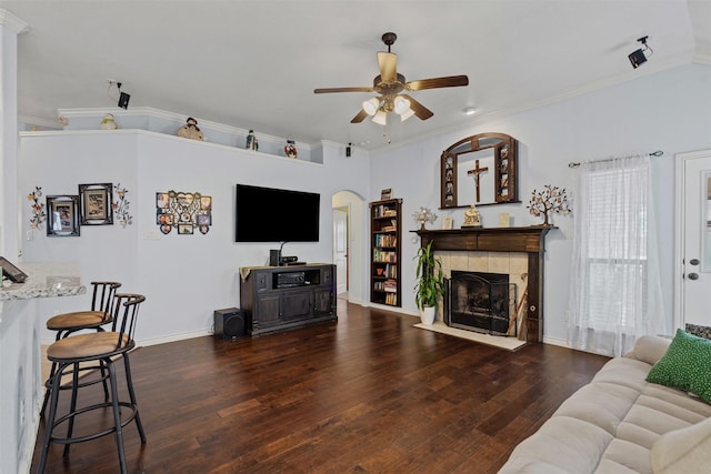 5929 Black Bass Dr, Fort Worth, TX 76179 - living room featuring ceiling fan, ornamental molding, a tile fireplace, wood-type flooring, and baseboards