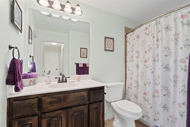 5929 Black Bass Dr, Fort Worth, TX 76179 - full bathroom featuring toilet, curtained shower, and vanity