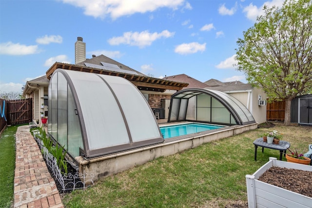 5929 Black Bass Dr, Fort Worth, TX 76179 - back of property with a shed, a yard, a chimney, a fenced backyard, and an outdoor structure