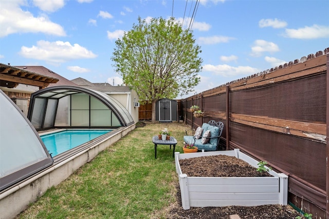 5929 Black Bass Dr, Fort Worth, TX 76179 - view of yard featuring a shed, a fenced backyard, an outbuilding, and a fenced in pool