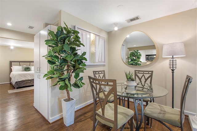 4241 Buena Vista St Unit 14, Dallas, TX 75205 - dining area featuring recessed lighting, visible vents, baseboards, and wood finished floors