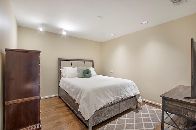 4241 Buena Vista St Unit 14, Dallas, TX 75205 - bedroom featuring wood finished floors, baseboards, visible vents, and recessed lighting