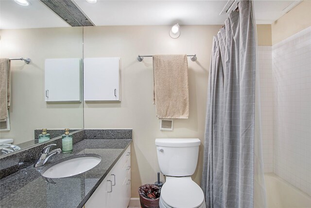 4241 Buena Vista St Unit 14, Dallas, TX 75205 - full bathroom featuring toilet, shower / bath combo, vanity, and visible vents