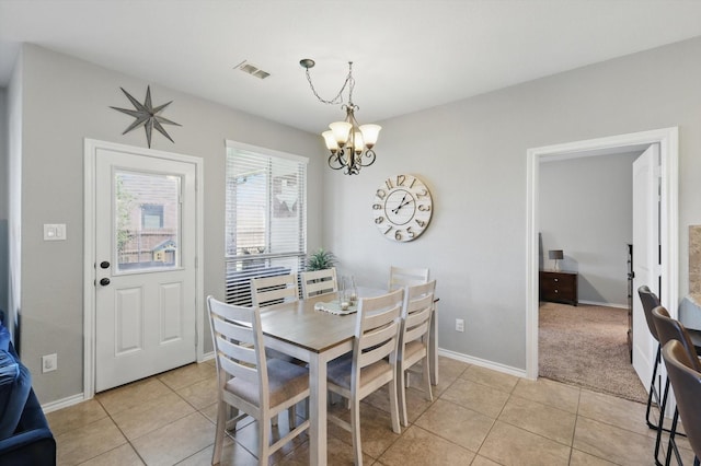 336 Avila Ln, Fort Worth, TX 76052 - dining area with light tile patterned floors and a chandelier