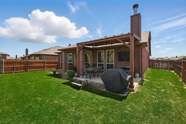 336 Avila Ln, Fort Worth, TX 76052 - back of house with a chimney, a fenced backyard, a patio area, and brick siding