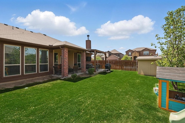 336 Avila Ln, Fort Worth, TX 76052 - fenced backyard with a patio area and a storage unit