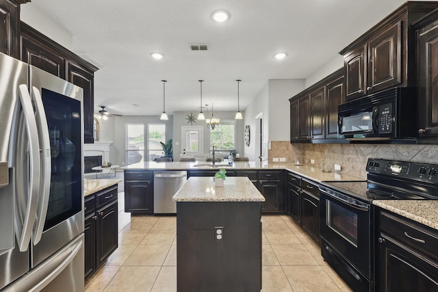 336 Avila Ln, Fort Worth, TX 76052 - kitchen featuring black appliances, a peninsula, open floor plan, tasteful backsplash, and a ceiling fan