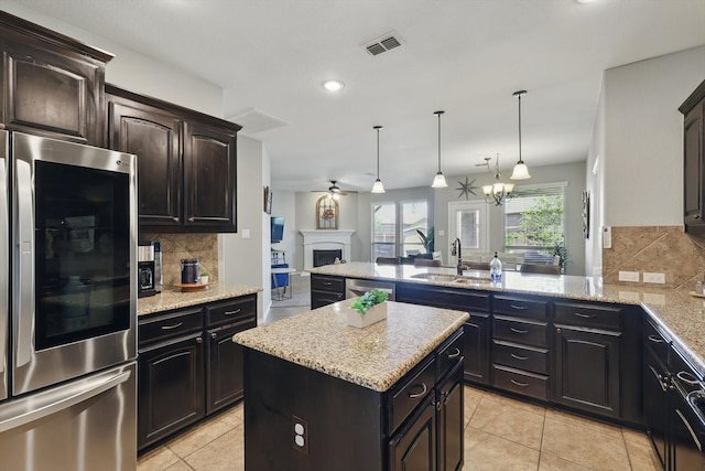 336 Avila Ln, Fort Worth, TX 76052 - kitchen with stainless steel appliances, tasteful backsplash, open floor plan, a peninsula, and recessed lighting