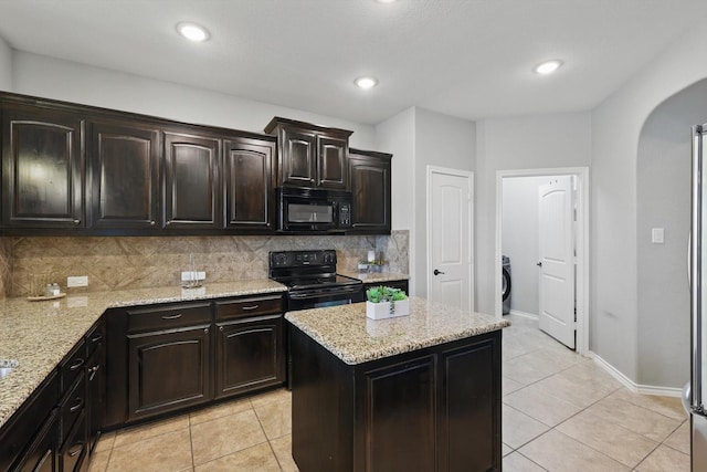 336 Avila Ln, Fort Worth, TX 76052 - kitchen featuring black appliances, arched walkways, tasteful backsplash, light tile patterned floors, and recessed lighting