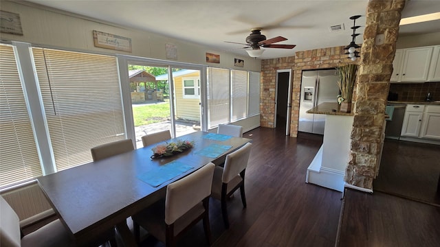 dining room with ceiling fan, dark wood finished floors, and visible vents