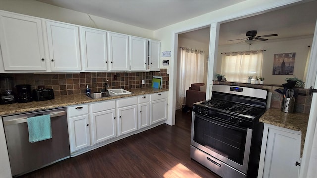 kitchen with white cabinetry, a sink, dark wood finished floors, and stainless steel appliances