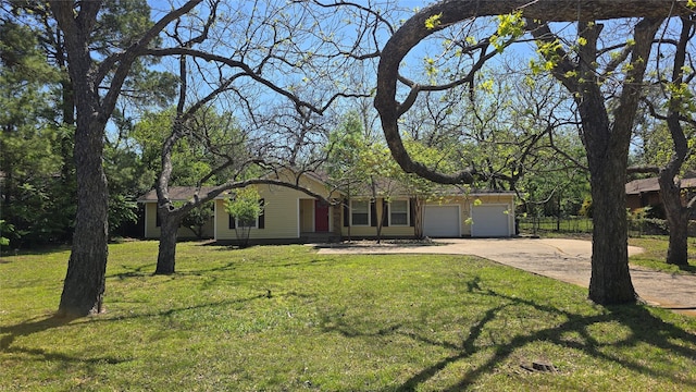 ranch-style house with concrete driveway, a front yard, and an attached garage