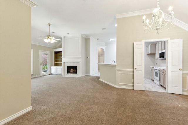 8425 Catskill Ct, Plano, TX 75025 - unfurnished living room featuring a fireplace with flush hearth, crown molding, vaulted ceiling, light carpet, and ceiling fan with notable chandelier