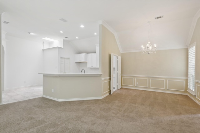 8425 Catskill Ct, Plano, TX 75025 - unfurnished living room with vaulted ceiling, a chandelier, light colored carpet, crown molding, and recessed lighting