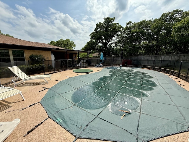 view of pool with a patio, a fenced backyard, and a fenced in pool