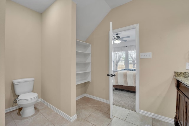 2112 Atlantic Ave, Anna, TX 75409 - bathroom featuring toilet, ceiling fan, vanity, vaulted ceiling, and tile patterned flooring